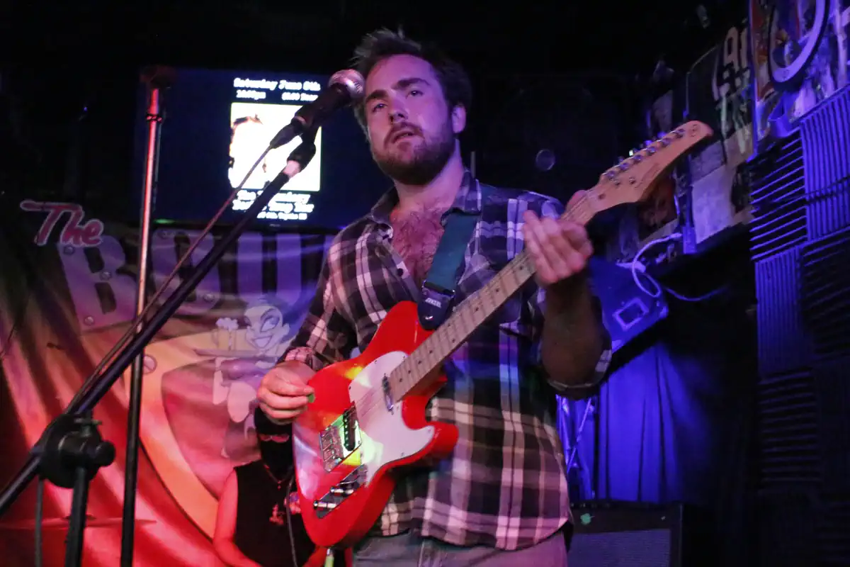 Cash of CRASH punk band performing live at The Boobie Trap in Topeka, Kansas